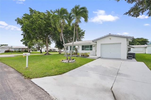 single story home with a front yard and a garage