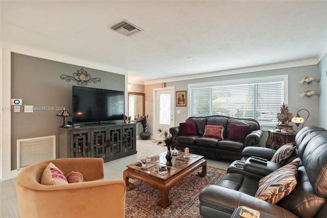 tiled living room with crown molding