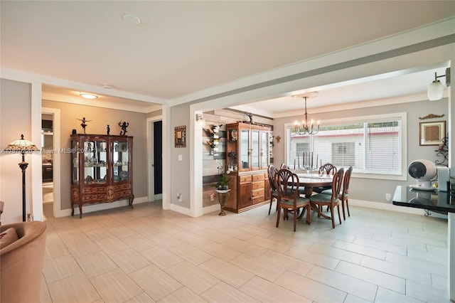 dining space with an inviting chandelier