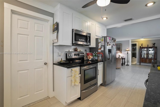 kitchen with ceiling fan, tasteful backsplash, stainless steel appliances, ornamental molding, and white cabinetry