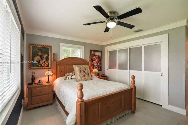 bedroom featuring ceiling fan and ornamental molding