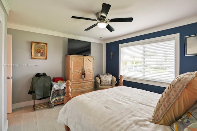 bedroom featuring crown molding and ceiling fan