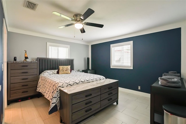 bedroom featuring crown molding and ceiling fan