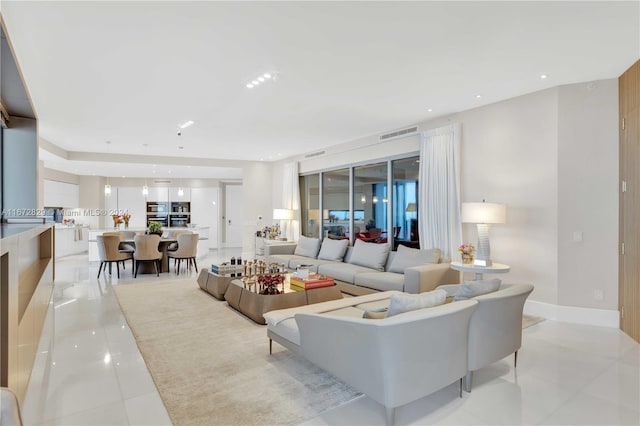 living area with light tile patterned floors