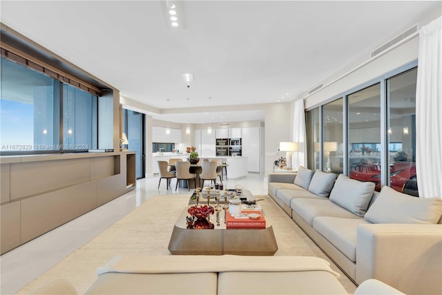 living area featuring light tile patterned floors