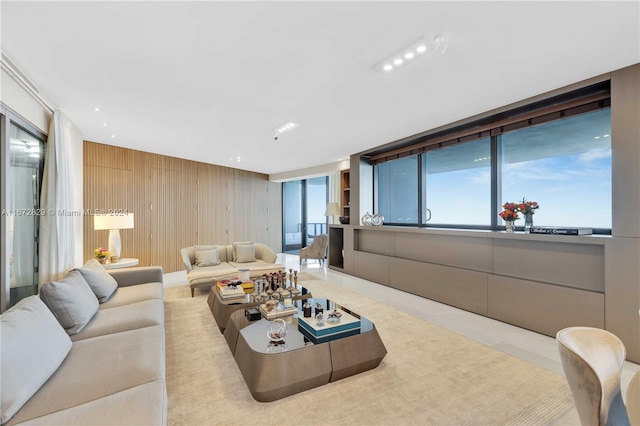 tiled living area featuring wood walls
