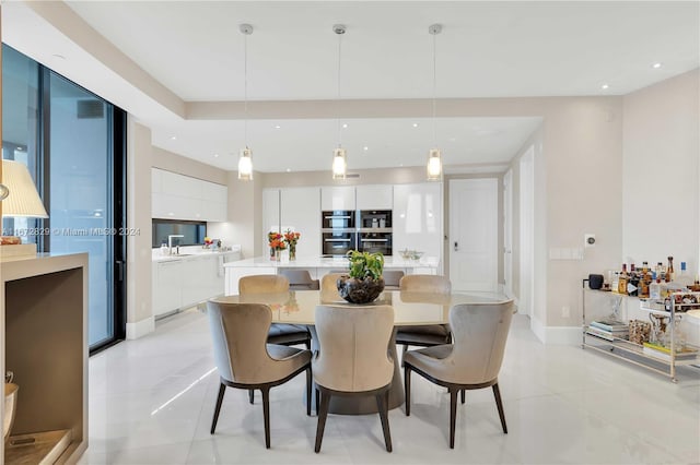 dining room with light tile patterned flooring, recessed lighting, and baseboards