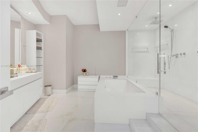 bathroom with independent shower and bath, vanity, and tile patterned flooring