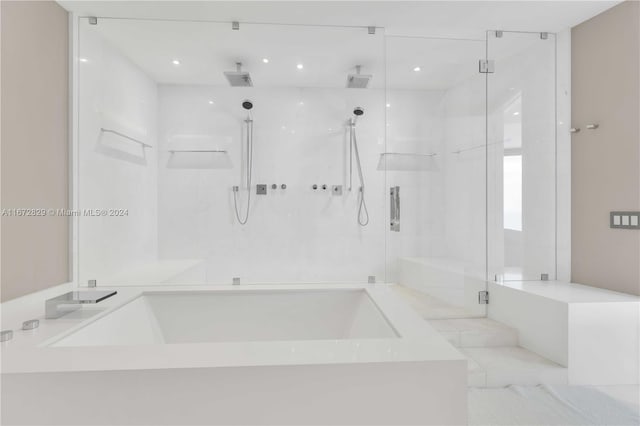 full bath featuring a shower stall, a bath, and recessed lighting