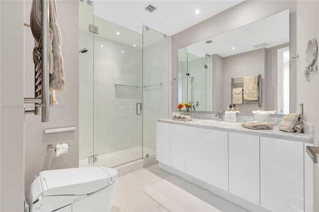 bathroom with vanity, a shower with shower door, toilet, and tile patterned floors