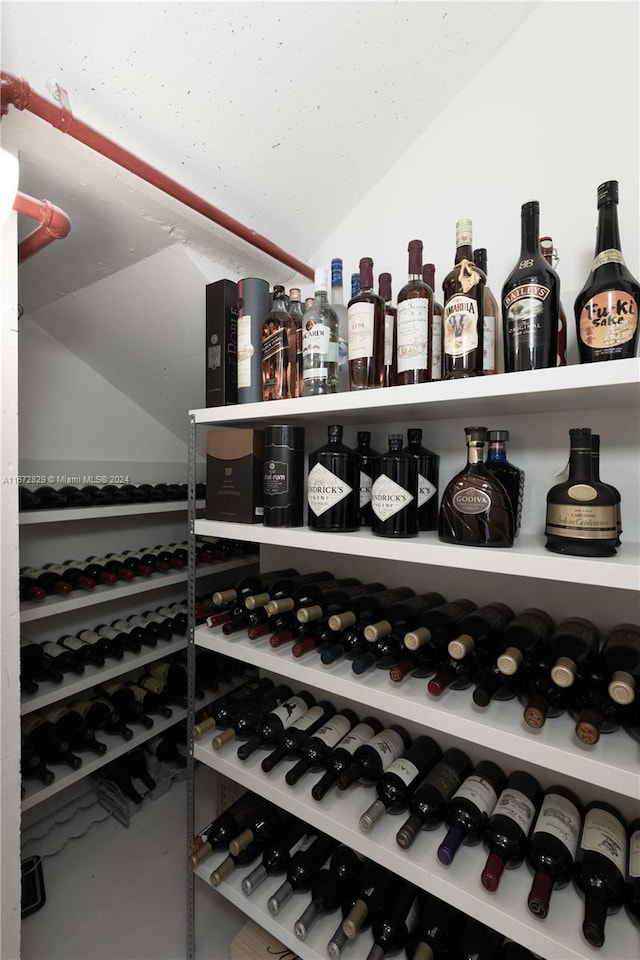 wine area with vaulted ceiling