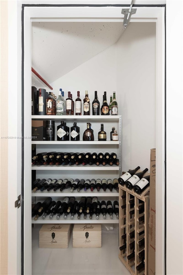 wine cellar featuring lofted ceiling