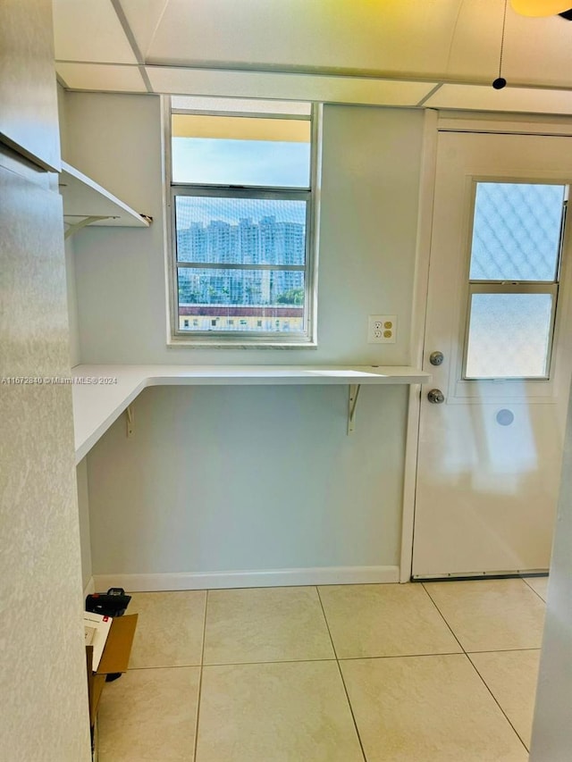 washroom with light tile patterned floors