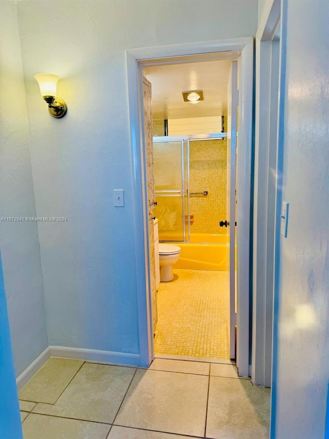 hall with light tile patterned flooring