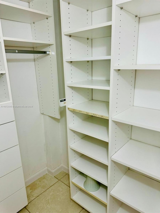 walk in closet featuring light tile patterned floors