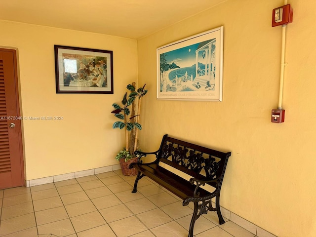 hall with tile patterned flooring