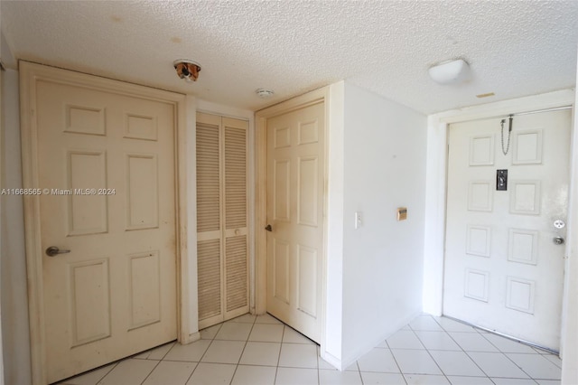 10360 NW 30th Ct Unit 204, Sunrise, FL 33322 - foyer with a textured ceiling and light tile patterned floors