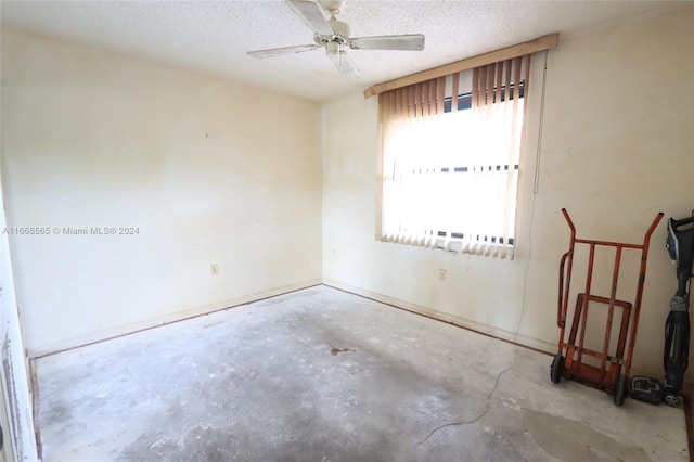 10360 NW 30th Ct Unit 204, Sunrise, FL 33322 - unfurnished room with unfinished concrete floors, a textured ceiling, and ceiling fan