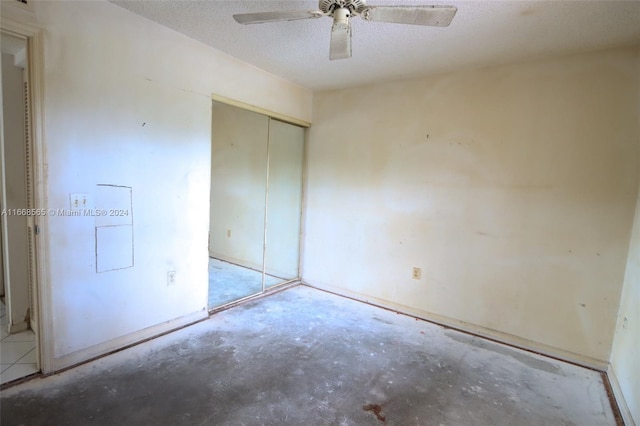 10360 NW 30th Ct Unit 204, Sunrise, FL 33322 - unfurnished bedroom featuring concrete floors, a closet, and a ceiling fan