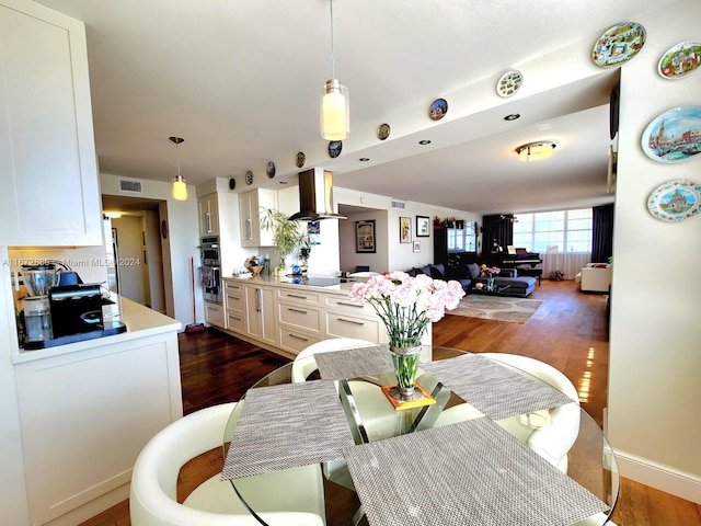 dining room with dark hardwood / wood-style floors