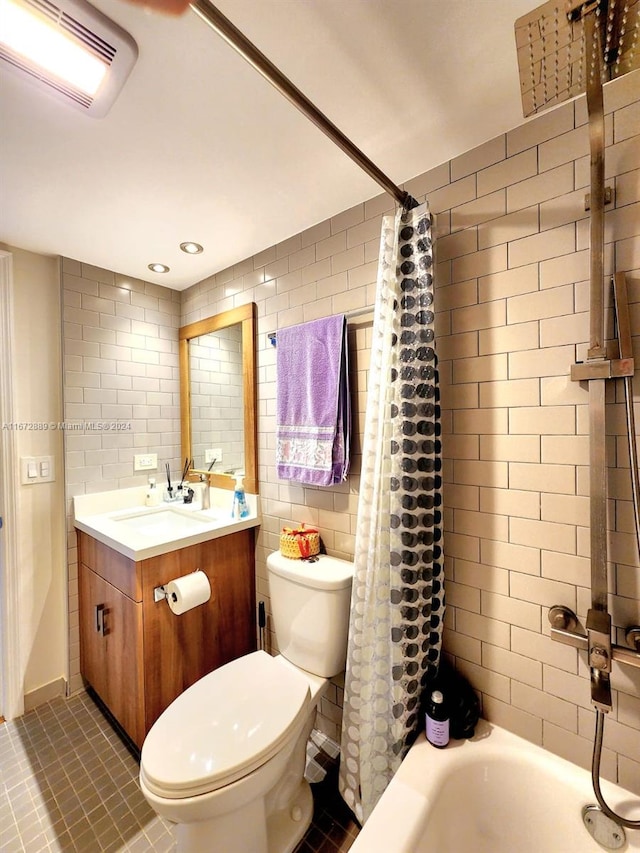 full bathroom featuring shower / bathtub combination with curtain, tile patterned floors, vanity, and toilet