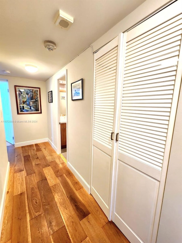 corridor featuring light hardwood / wood-style floors