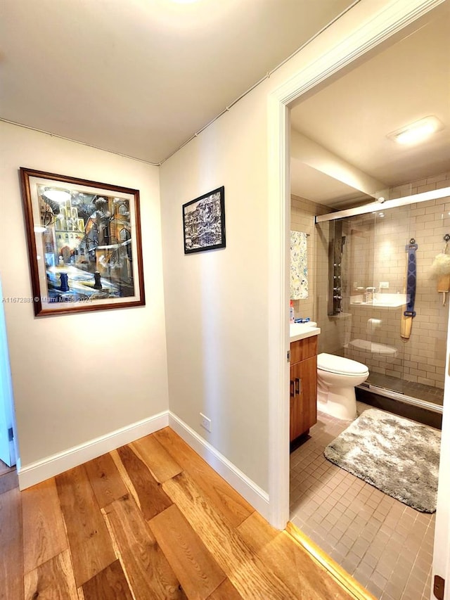 hallway with light hardwood / wood-style flooring