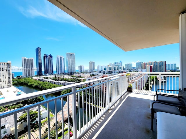 balcony featuring a water view