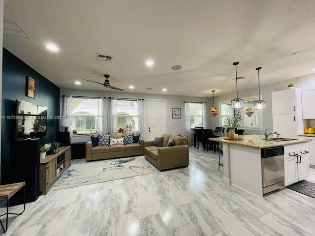 living room with sink and ceiling fan