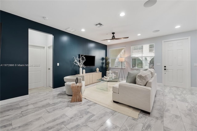 living area featuring a ceiling fan, recessed lighting, visible vents, and baseboards