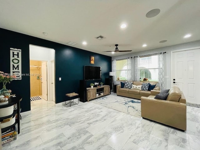 living room featuring ceiling fan