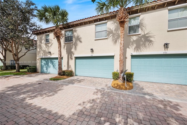 4184 Cascada Cir, Cooper City, FL 33024 - multi unit property with driveway, a tiled roof, a garage, and stucco siding