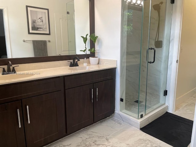 bathroom with vanity and an enclosed shower