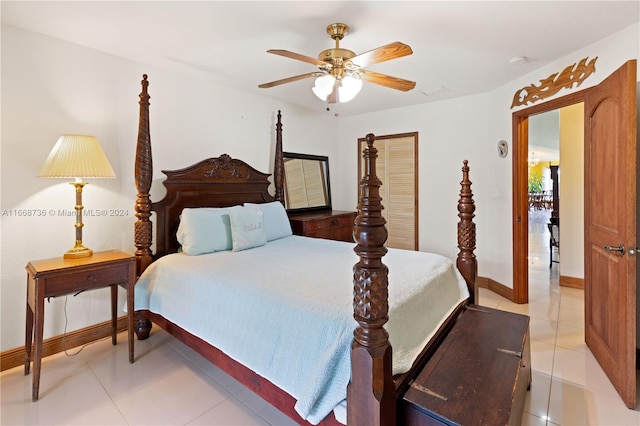 bedroom with ceiling fan and light tile patterned floors