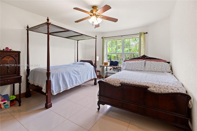 tiled bedroom with ceiling fan