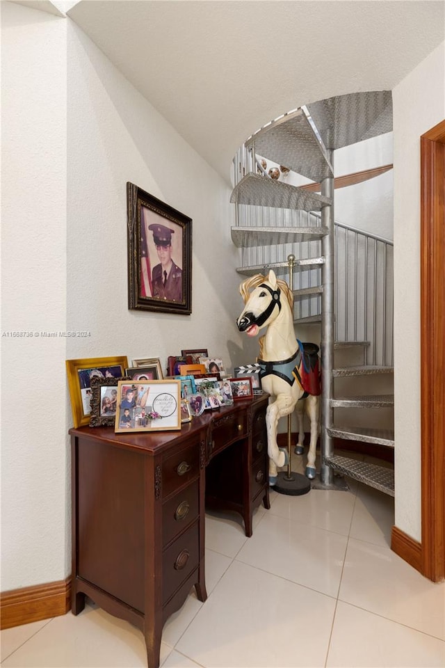 home office with light tile patterned floors