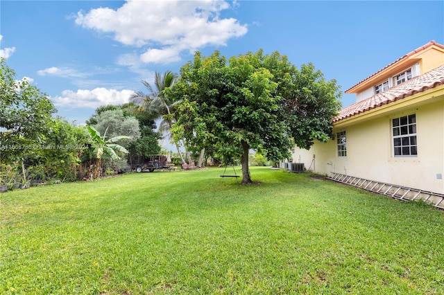 view of yard with central AC