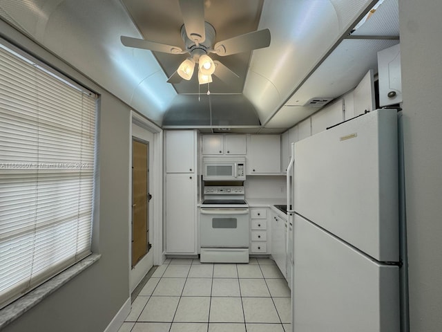 kitchen with ceiling fan, light tile patterned floors, white appliances, and white cabinetry