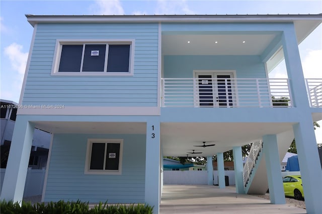 exterior space featuring ceiling fan