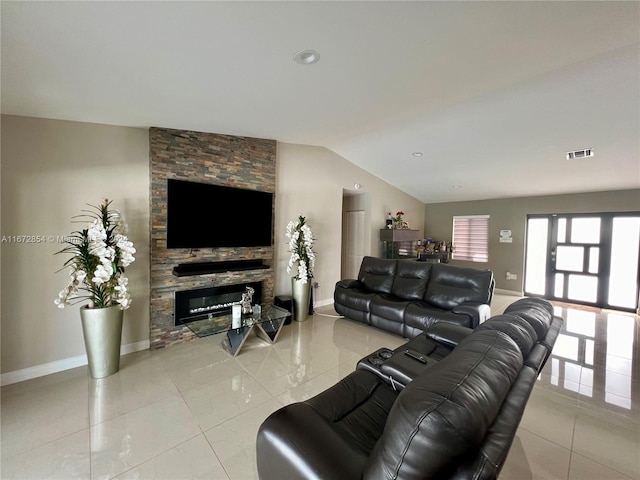 living room with a fireplace and vaulted ceiling