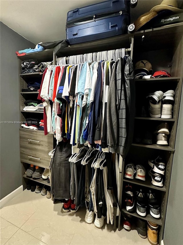 walk in closet featuring tile patterned flooring