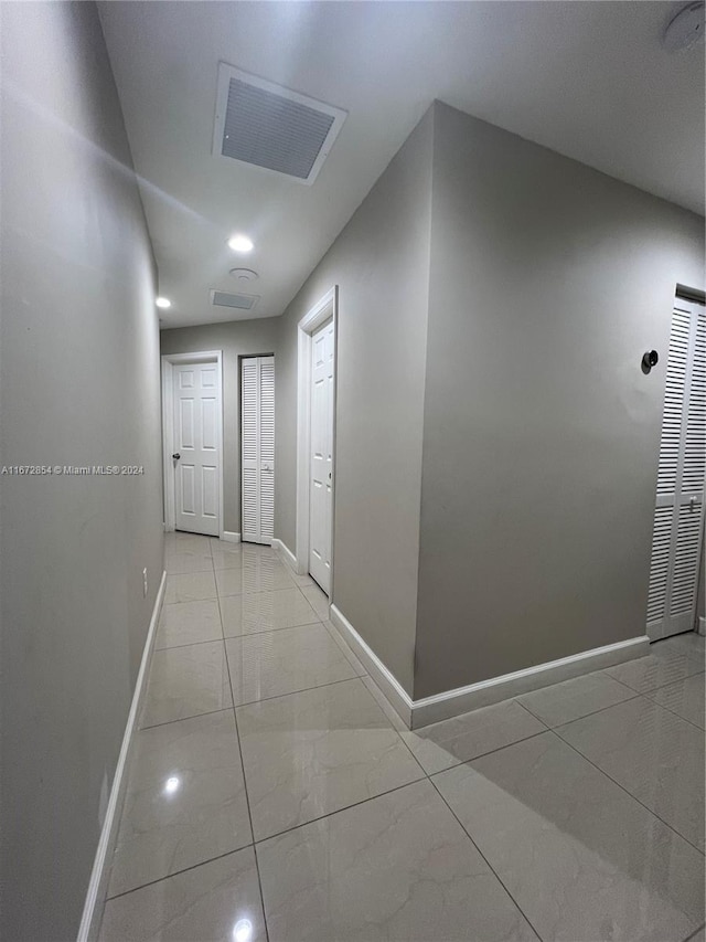 20461 SW 320th St, Homestead, FL 33030 - hallway with baseboards and light marble finish floors