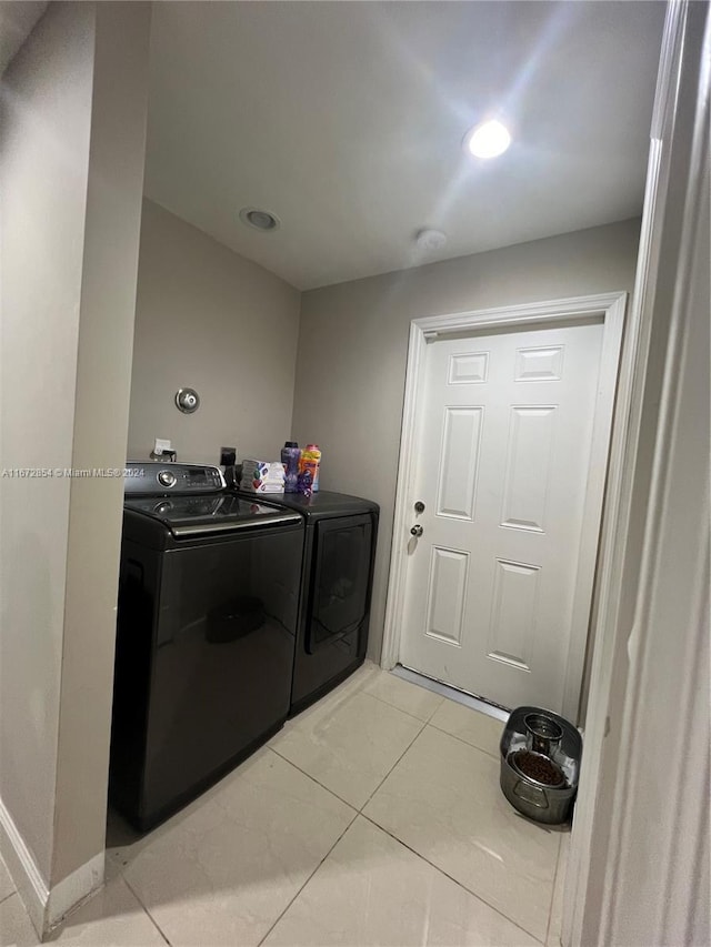 20461 SW 320th St, Homestead, FL 33030 - laundry area featuring washing machine and clothes dryer, light tile patterned floors, and recessed lighting