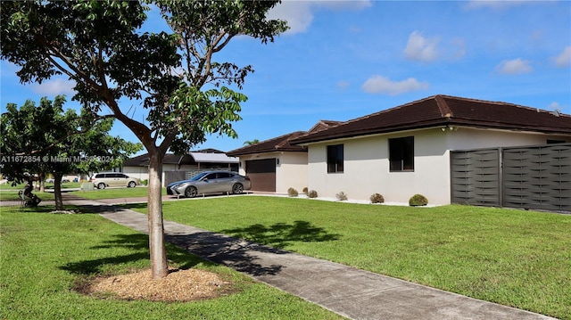 20461 SW 320th St, Homestead, FL 33030 - view of side of home with a garage, stucco siding, a lawn, and concrete driveway