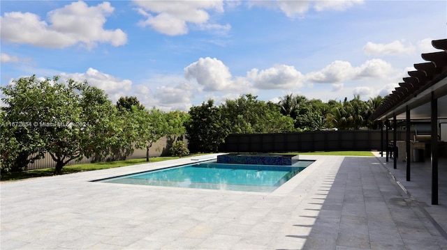 view of swimming pool featuring a patio area