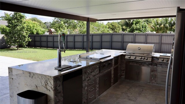 view of patio / terrace featuring area for grilling and a grill