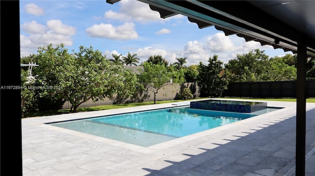 view of swimming pool featuring an in ground hot tub and a patio area