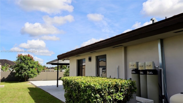 exterior space with a patio and a yard