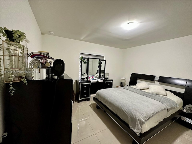 bedroom with light tile patterned flooring