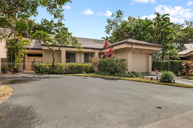 single story home featuring a garage